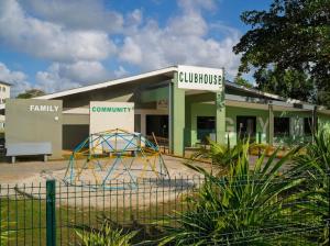 a building with a playground in front of it at East Lake Oasis in Arima