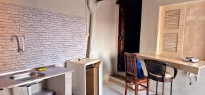a kitchen with a sink and a table and chairs at Condomínio em Canoa Quebrada in Aracati +11 photos