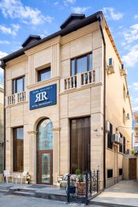 a building with a sign on the front of it at Royal Renaissance Boutique by IGIT in Yerevan +50 photos