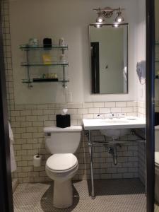 a bathroom with a toilet and a sink at Hollywood Hotel in Los Angeles
