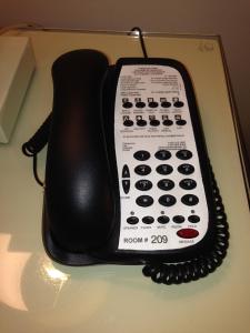 a telephone sitting on top of a table at Hollywood Hotel in Los Angeles