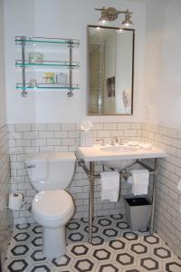 a bathroom with a toilet and a sink at Hollywood Hotel in Los Angeles