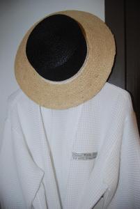 a person wearing a straw hat on a white shirt at Hollywood Hotel in Los Angeles