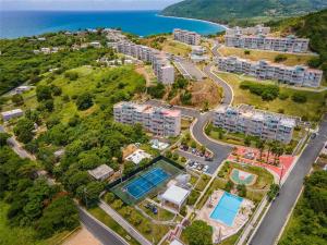 an aerial view of an apartment complex next to the ocean at NaboBlue Ocean View Apartment Maunabo PR in Maunabo