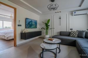 a living room with a couch and a table at RamoHouse bright home central in Chefchaouen