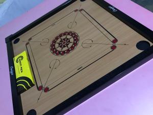 a wooden cutting board with a wheel on it at Seri Pengkalan Holiday House 2 in Bachok