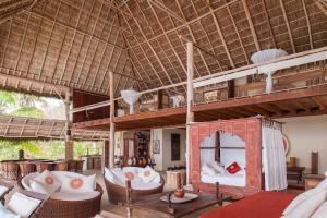 a living room with a loft bed in a resort at Palapa Ganesh in Sayulita