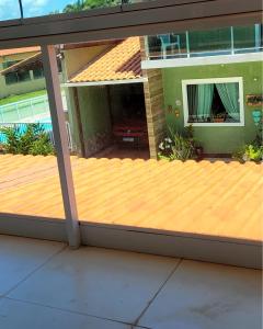 a deck in front of a house at LardoceLar in Camaçari +2 photos