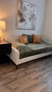 a couch sitting in a living room with a table at Little Gem in Millersburg