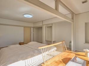 a bedroom with a bed and a table at Oyado S in Hakone +85 photos