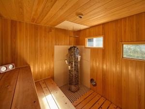 a room with a sauna with wooden walls at Oyado S in Hakone