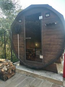 a circular building with a large window on a patio at saunalu in Kido