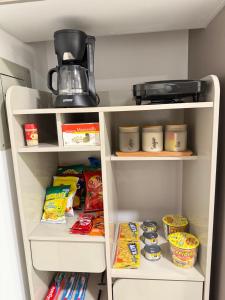 a refrigerator filled with lots of food and a blender at Adagio Quito Suite de Lujo in Quito