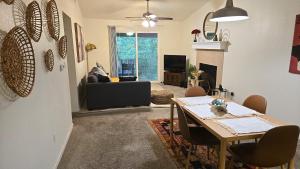 a living room with a table and a couch at Elegant 2Bed & 2 Bath Comfort in Dallas