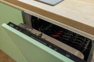 an oven with its door open in a kitchen at Central 2BR - Workspace with Elevator in Varna City