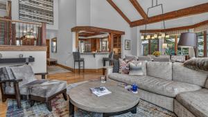 a living room with a couch and a table at Bergrose Lodge in Vail