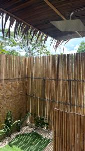 a wooden fence with a ceiling and a light at Vista Cadlao in El Nido