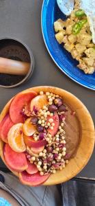 a plate of food with fruit and nuts on a table at Casa Laud Chacahua Isla in Guayabas +38 photos