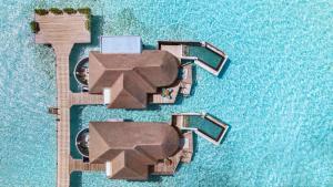 an overhead view of a resort with a pool at Six Senses Kanuhura in Lhaviyani Atoll