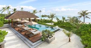 an aerial view of a resort with a swimming pool at Six Senses Kanuhura in Lhaviyani Atoll
