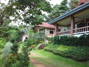a house with a garden in front of it at Freedom Estate in Ko Lanta