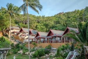 a resort with palm trees in front of it at Crystal Bay Yacht Club Beach Resort in Lamai