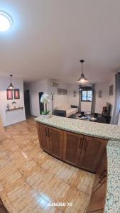 a kitchen and living room with a large counter top at El Bosque Nomada 4 in El Bosque