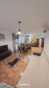 a living room with a couch and a table at El Bosque Nomada 4 in El Bosque