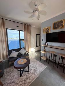 a living room with a couch and a table at Ekuku retreat in Oshakati