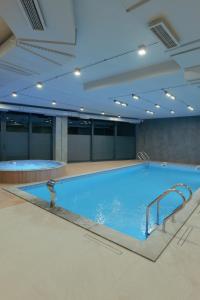 a large swimming pool in a large room at VAK Resort Dilijan in Dilijan