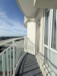 a balcony of a building with a view of the water at Cozy Studio Condo with Stunning Tagaytay Views in Tagaytay