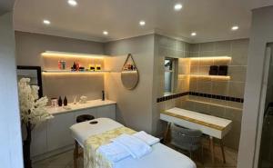 a bathroom with a bed and a sink and a mirror at 314 on Clark Guest House in Pretoria +169 photos
