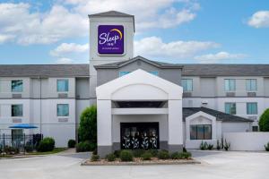 a building with a purple sign on top of it at Sleep Inn Baton Rouge East I-12 in Baton Rouge