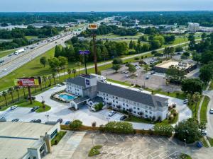 an aerial view of a building with a parking lot at Sleep Inn Baton Rouge East I-12 in Baton Rouge