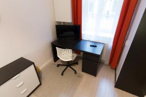 Televízia a/alebo spoločenská miestnosť v ubytovaní BpR Oktogon Center Apartment