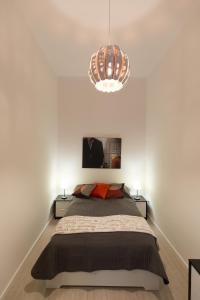 Posteľ alebo postele v izbe v ubytovaní BpR Oktogon Center Apartment
