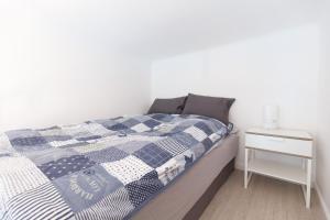 Posteľ alebo postele v izbe v ubytovaní BpR Oktogon Center Apartment