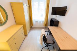 Televízia a/alebo spoločenská miestnosť v ubytovaní BpR Oktogon Center Apartment