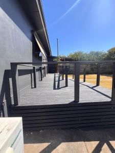 a group of tables on the side of a building at Holiday Home in Warrnambool in Warrnambool +7 photos
