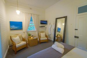 Ένα ή περισσότερα κρεβάτια σε δωμάτιο στο Bangalow Guesthouse