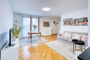 a living room with a couch and a table at Casa Altea in Pordenone