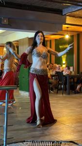 two women dancing on a dance floor at a party at Aslan City Hotel - Ex Beste Hotel in Alanya +127 photos