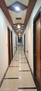 an empty hallway of an office building with a ceiling at Shyam Krapa in Rīngas