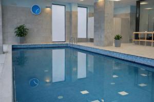 a swimming pool in a building at Weiser Hotel in Wrocław