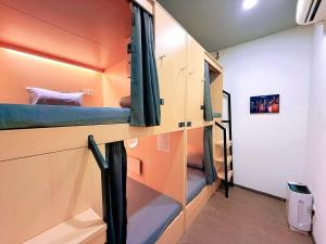 a small room with bunk beds in it at Coller Chinatown in Singapore