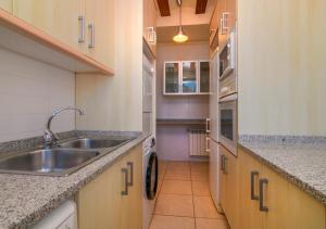 a kitchen with a sink and a counter top at Cal Metge de Gualba in gualba de Dalt