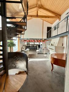 a living room with a chair and a table at Charming 6 bed chalet in 4 Valleés in Iserables