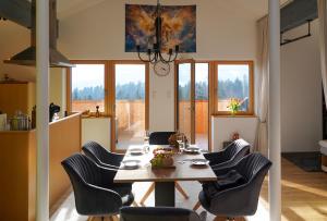 a dining room with a table and chairs at Ferienwohnung Vögel in Langenegg