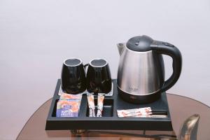 Kemudahan buat kopi dan teh di Urban Rooms - Self Check-in Ultra Central Medias