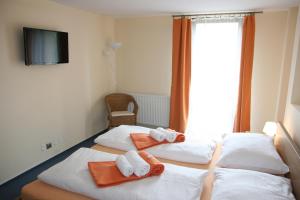 Posteľ alebo postele v izbe v ubytovaní Hotel Praha Potštejn